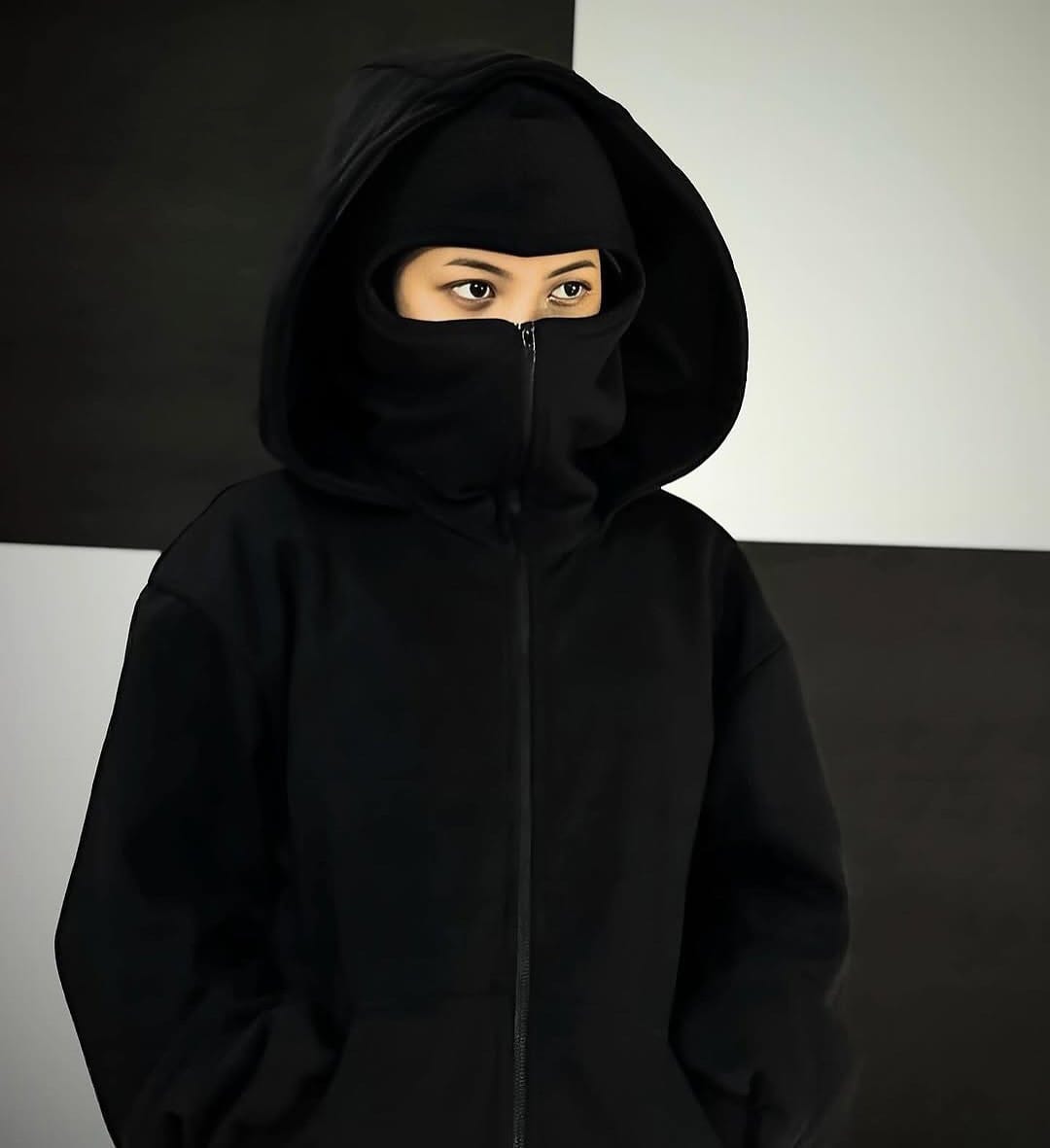 Model wearing Balaclava Hoodie in an urban streetwear setting